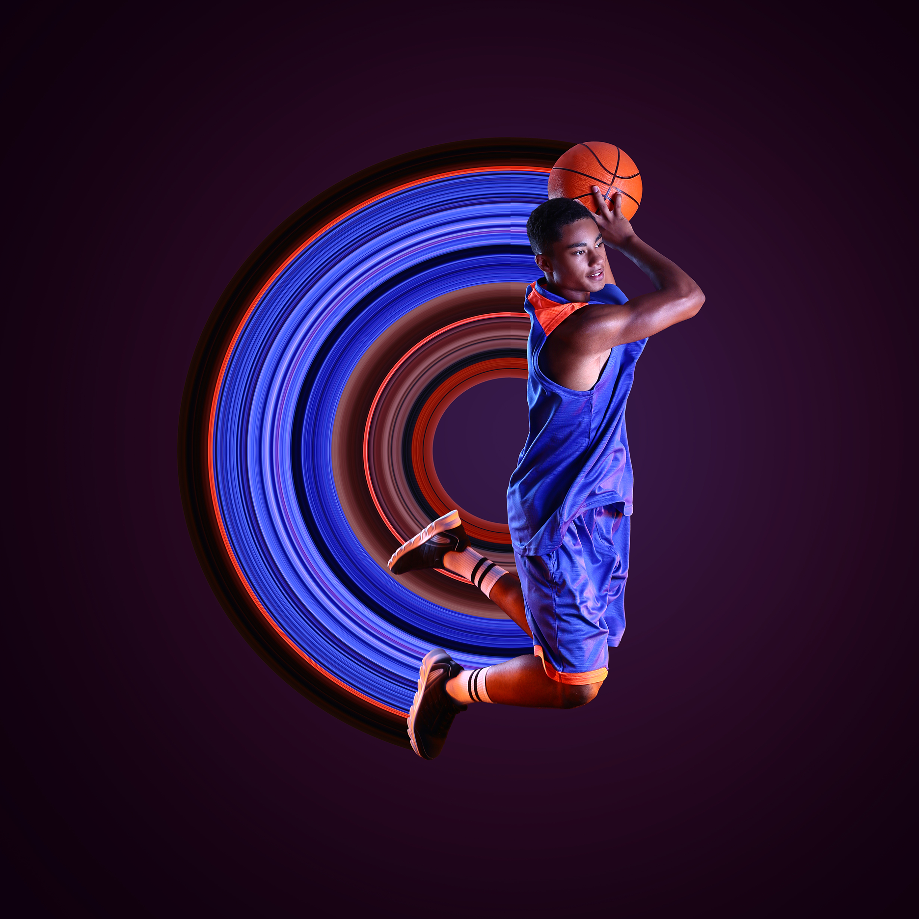 Creative photo manipulation — basketball player with light swirl